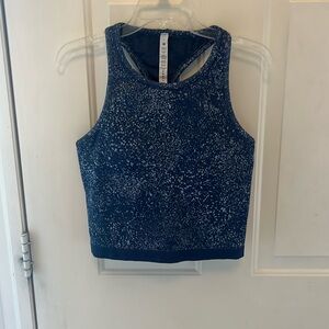 Lululemon blue razor back tank that’s more fitted and is cropped. Built in bra